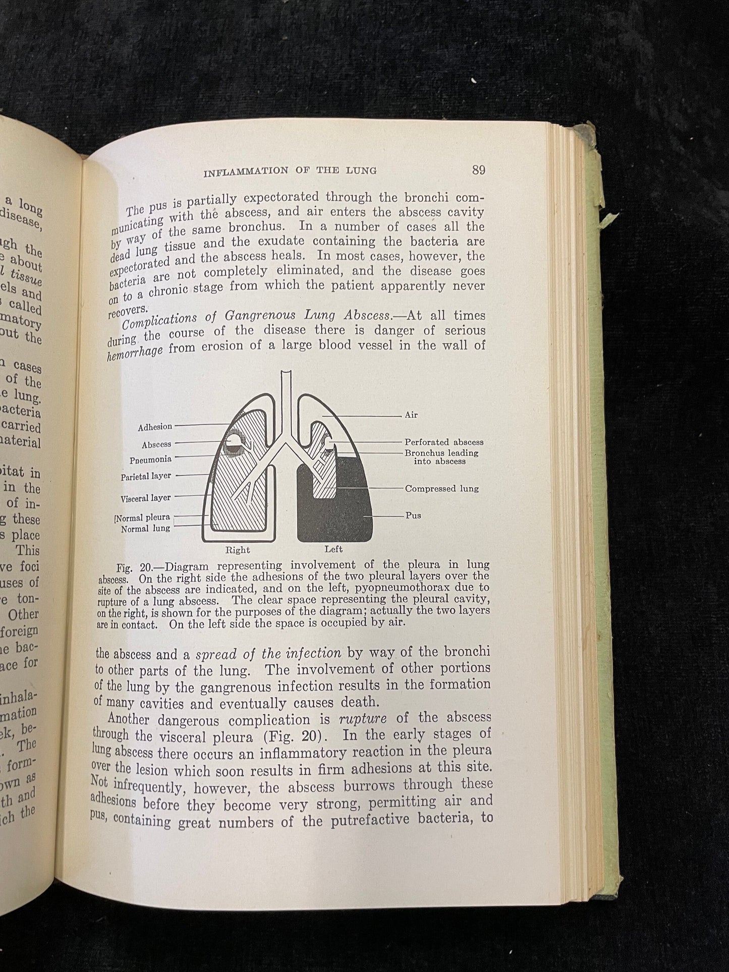 Open book with text and diagrams on a black background