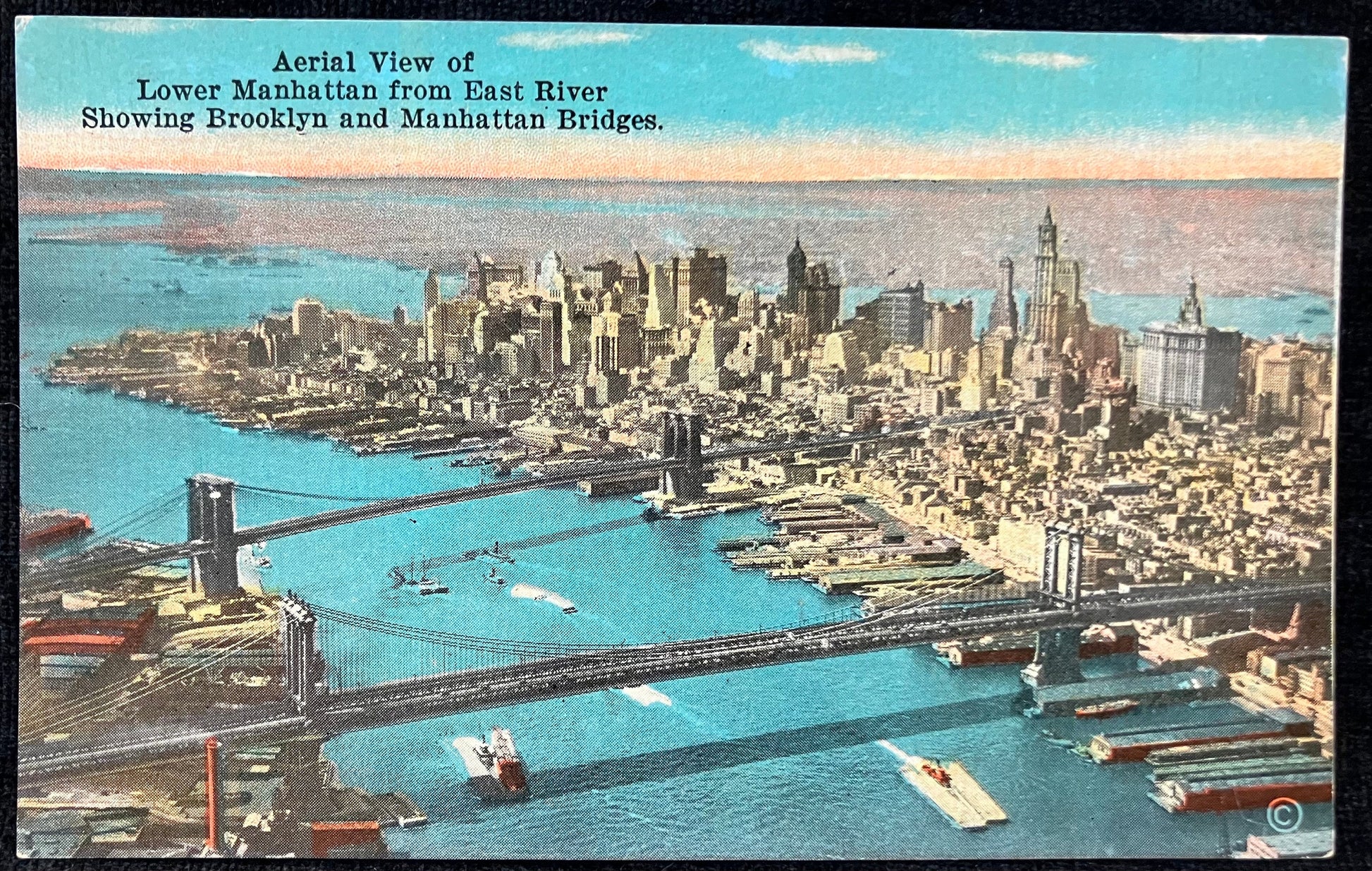 Aerial View of Lower Manhattan from East River Showing Brooklyn and Manhattan Bridges. - Vintage Pos