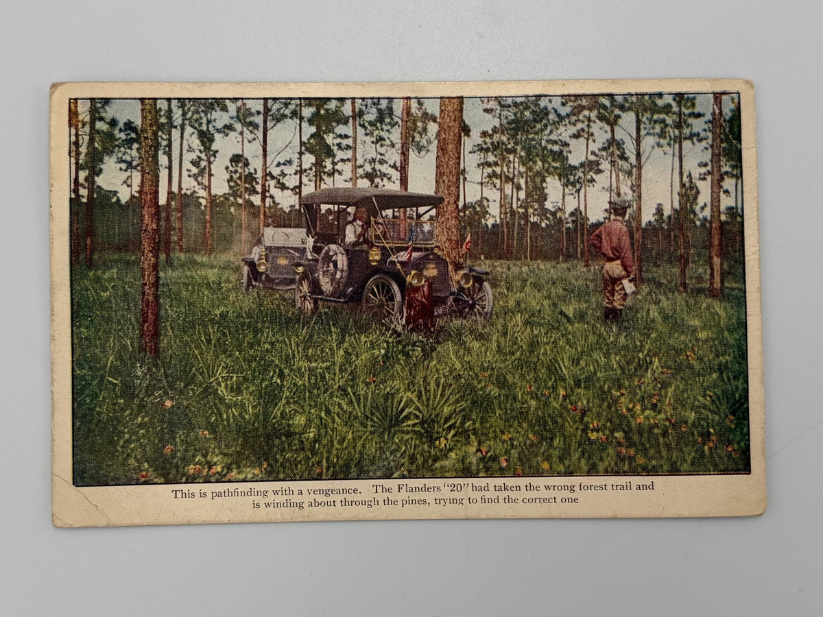 A vintage illustrated postcard showing a person in a garden or field near trees, photographed on a plain light gray surface.