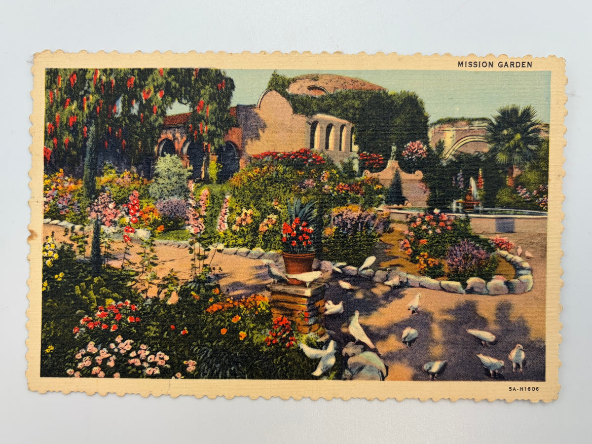 This linen postcard was printed in 1935 with a hand-colored view of the San Juan Capistrano gardens. The Mission Gardens are still open today.