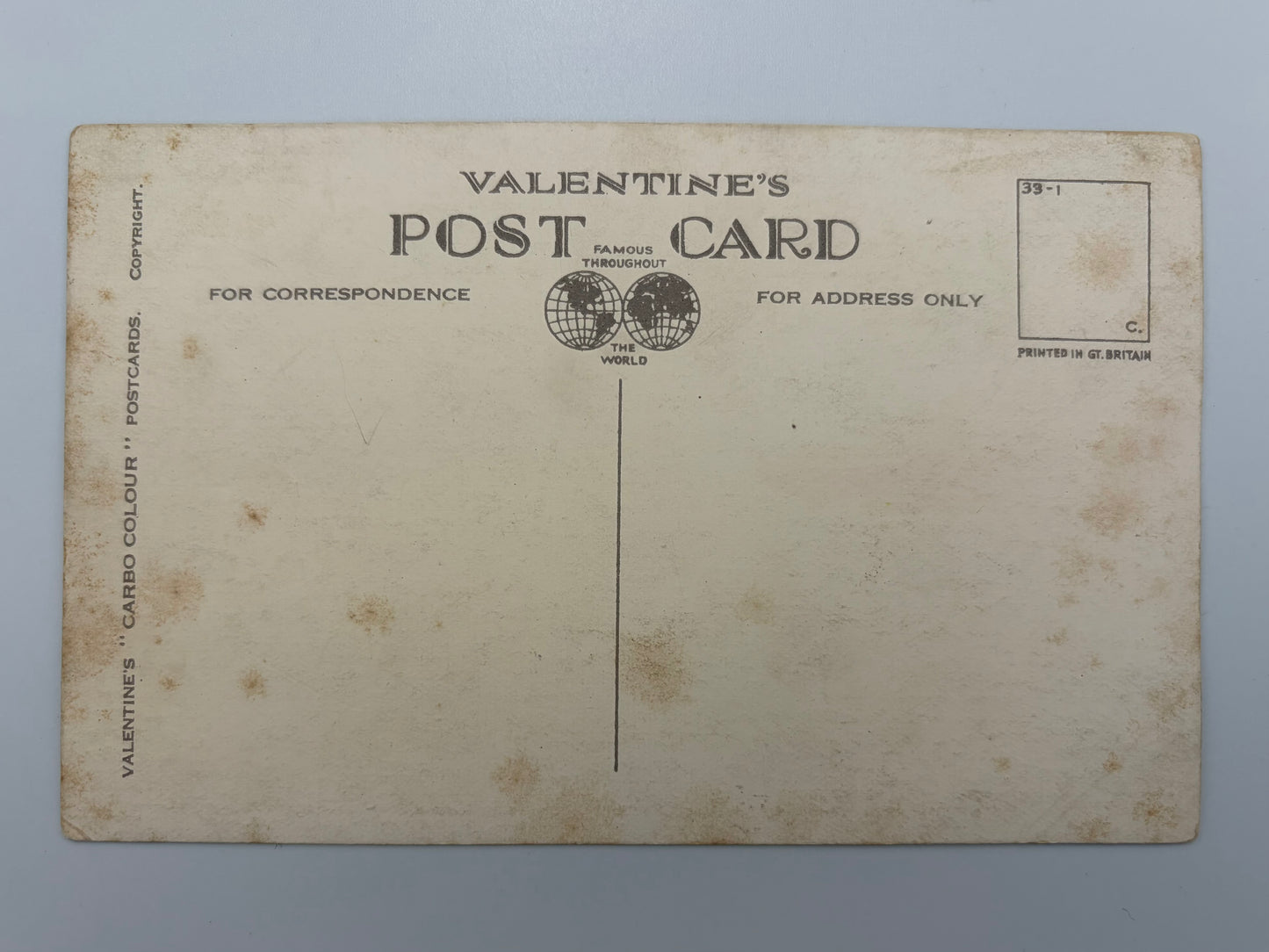 Vintage Valentine's postcard showing the back side with printed text, address lines, and a stamp box on an aged cream-colored card.