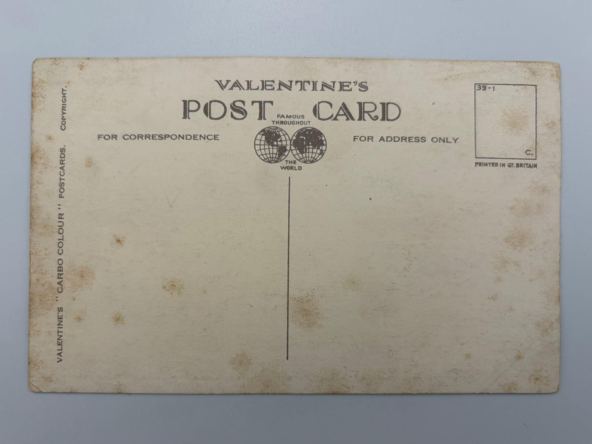 Vintage Valentine's postcard showing the back side with printed text, address lines, and a stamp box on an aged cream-colored card.