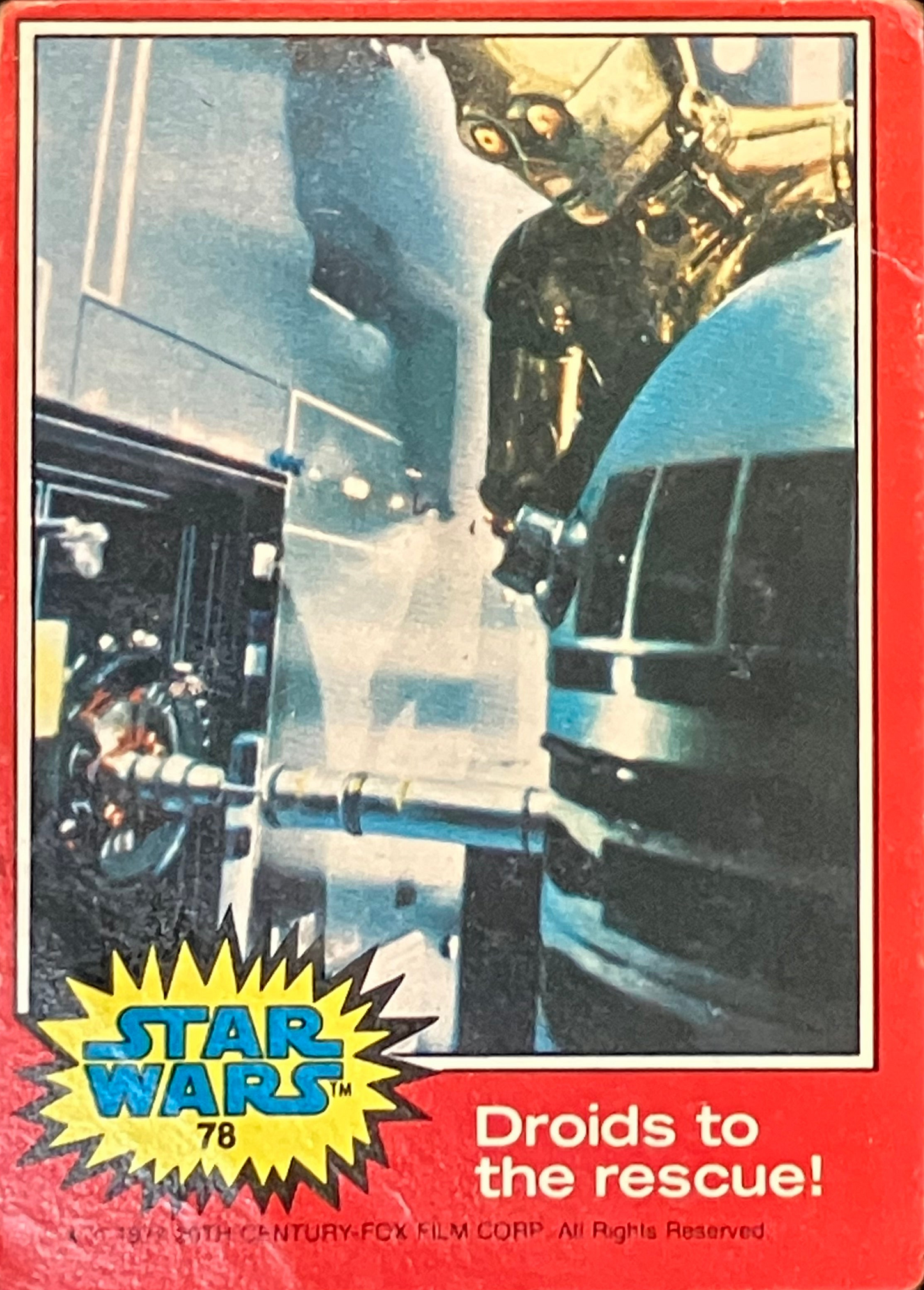 Vintage Star Wars trading card featuring R2-D2 and C3PO with text 'Droids to the rescue!' on a red border.