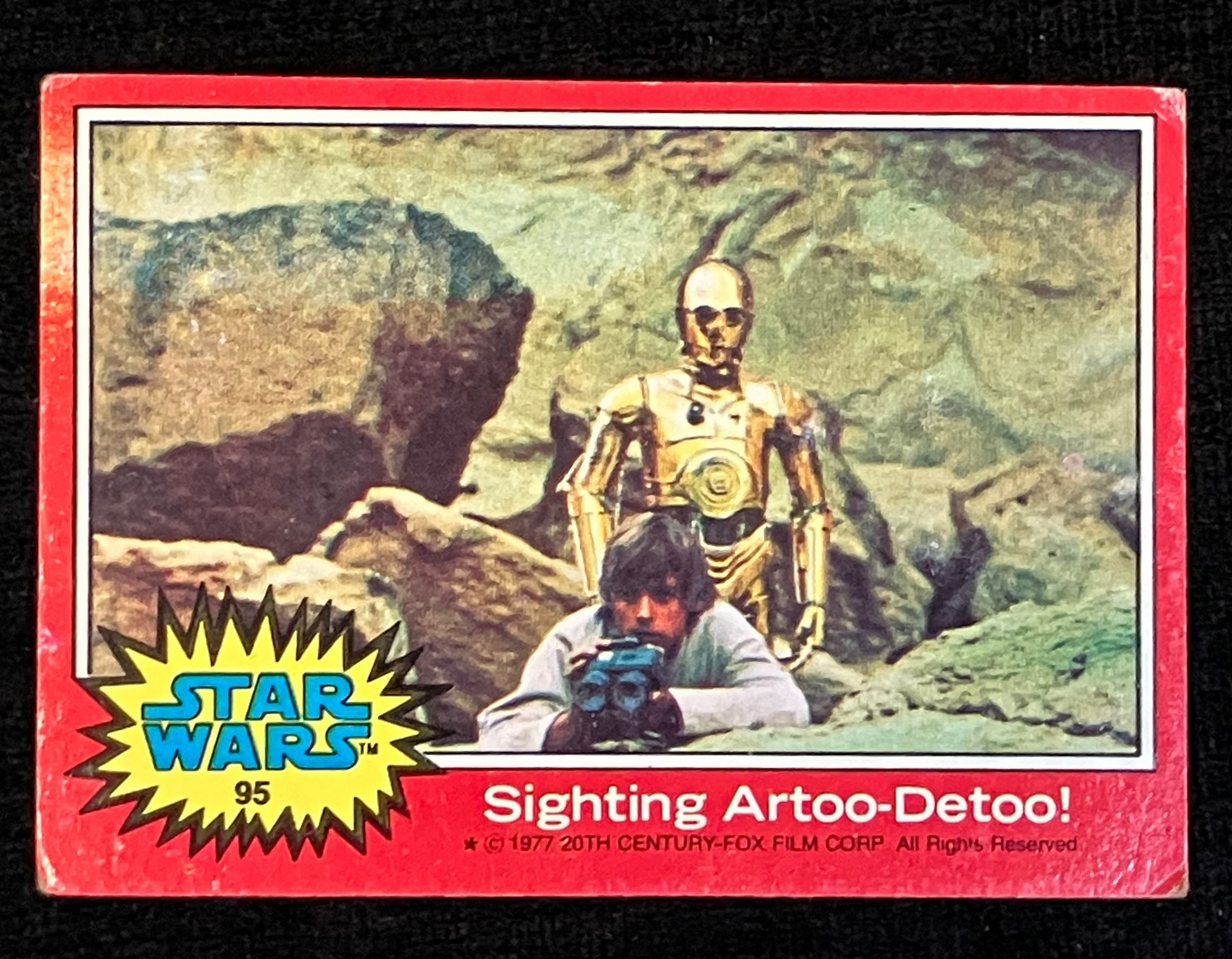 Vintage Star Wars trading card featuring Luke Skywalker and C-3PO on a rocky landscape with 'Star Wars' logo.