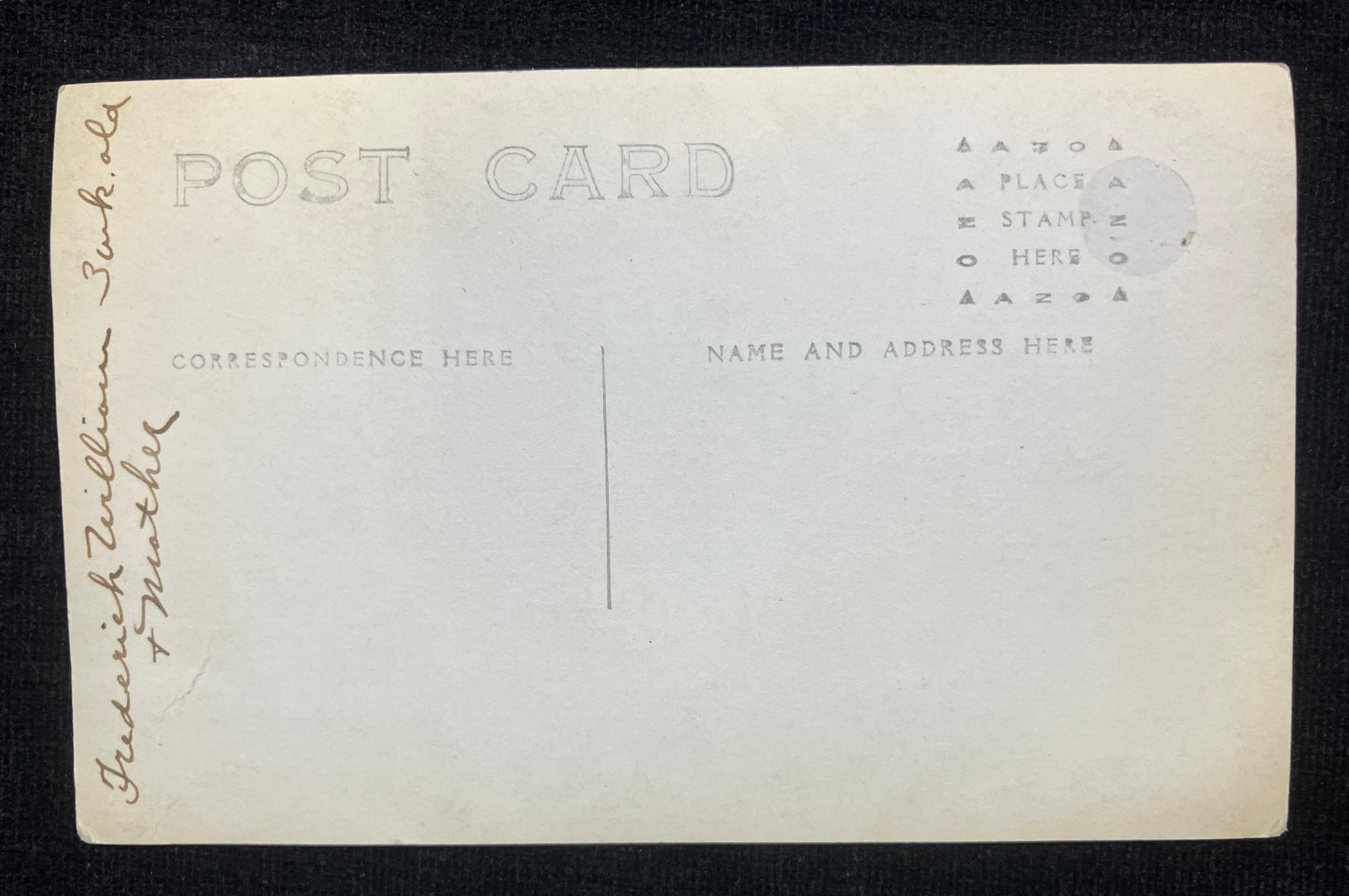 Back of a vintage postcard with printed text and space for writing.