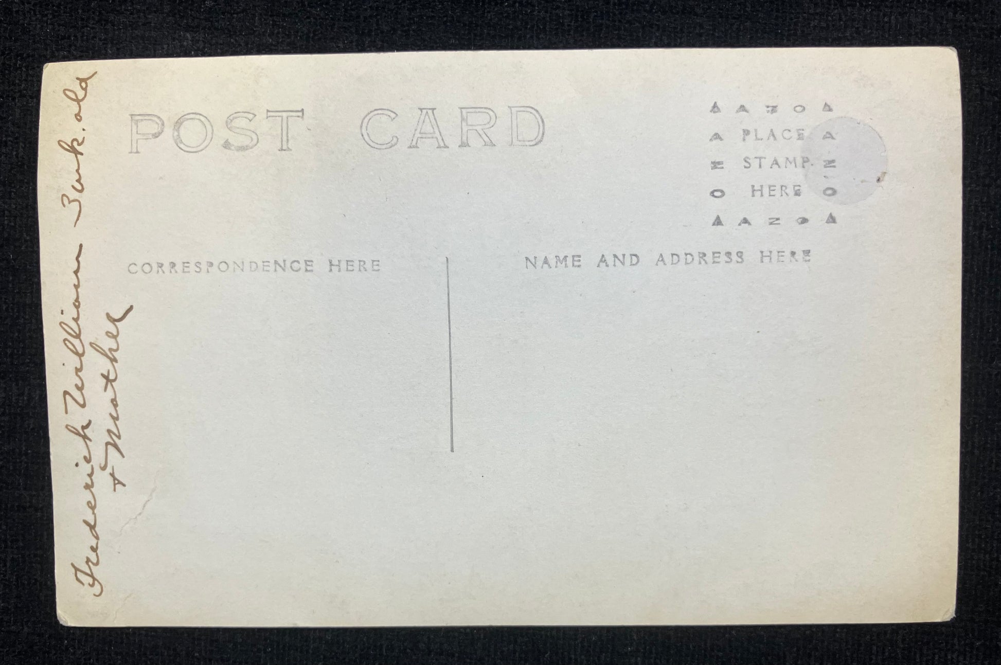 Back of a vintage postcard with printed text and space for writing.