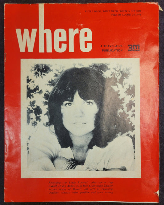 Vintage 'Where' magazine cover with a black and white photo of a woman on a red background