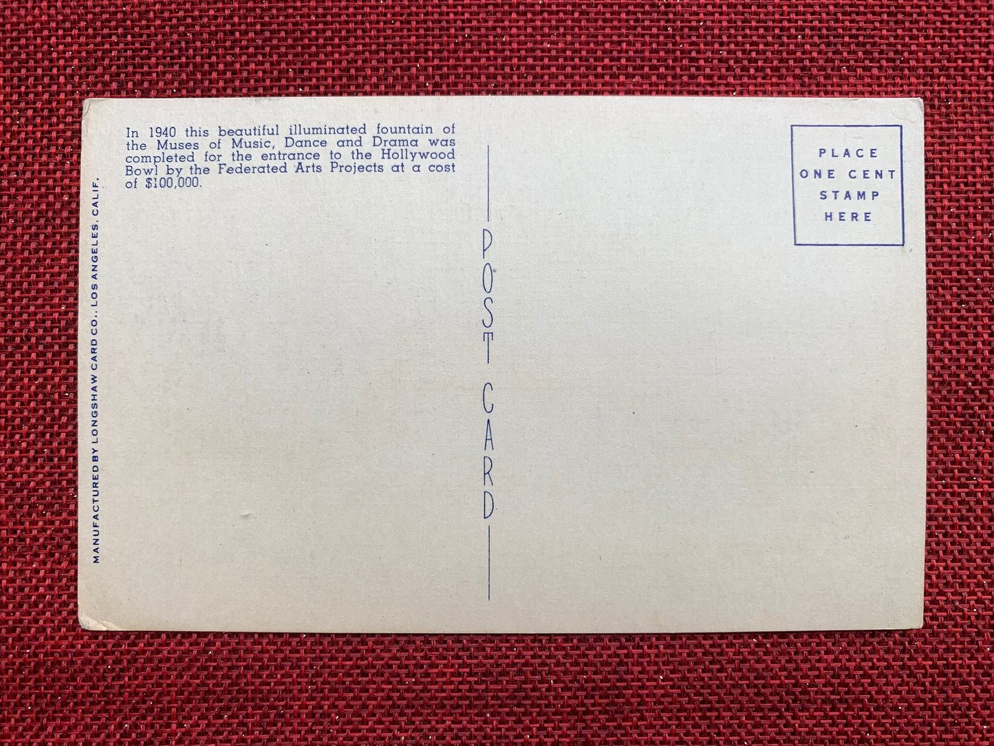This linen postcard features a hand tinted photograph of the entrance to the Hollywood Bowl and Cahuenga Pass Freeway in Hollywood, California. Back Text: "In 1940 this beautiful illuminated fountain of the Muses of Music, Dance and Drama was completed for the entrance to the Hollywood Bowl by the Federated Arts Project at a cost of $100,000."Postmark: None Publisher: Longshaw Card Co., Los Angeles, Calif.