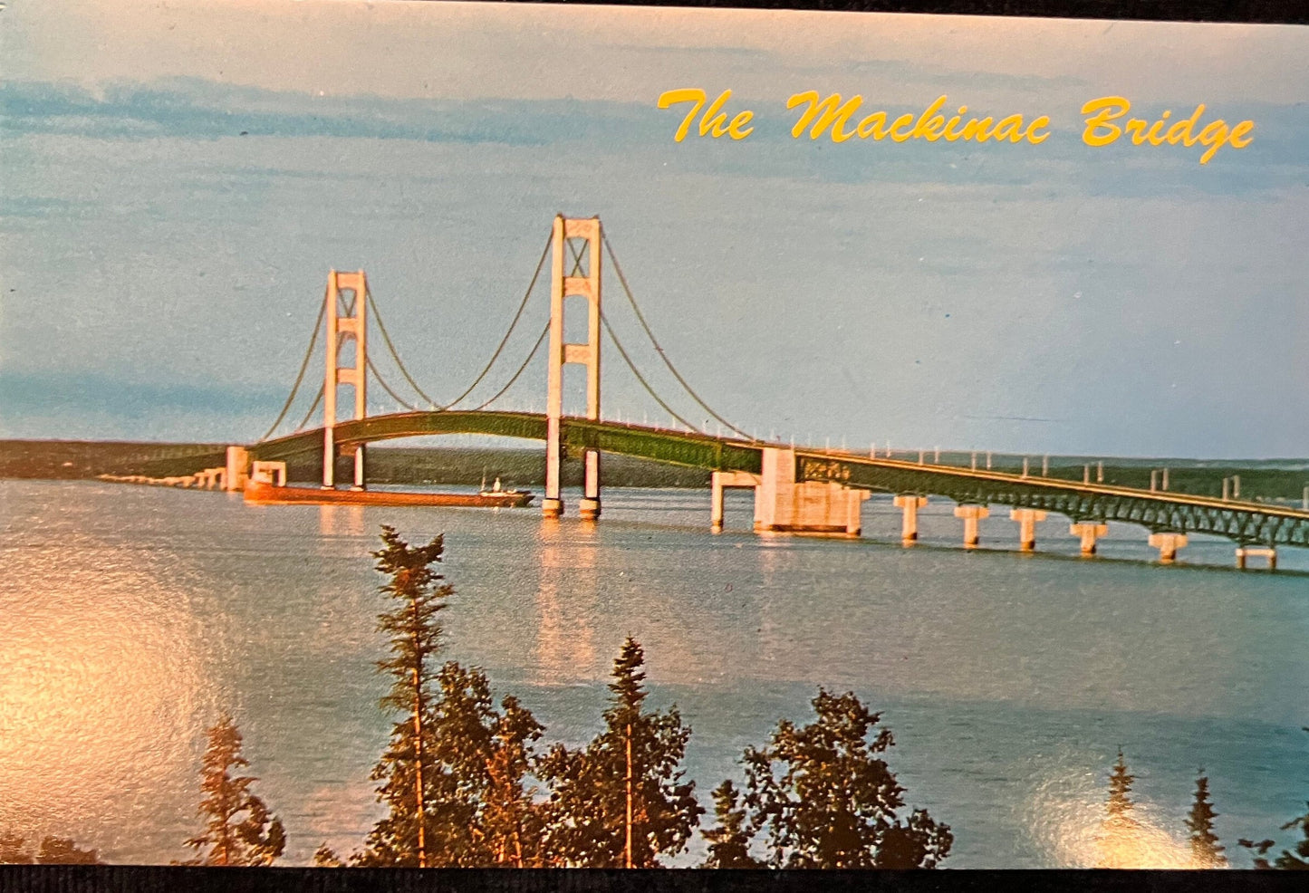 The Mackinac Bridge - Vintage Postcard with Tanker under the bridge
