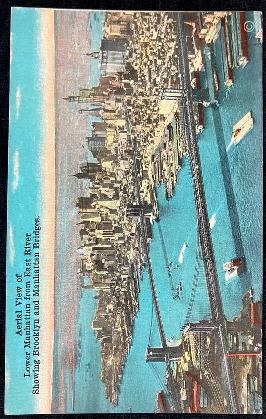 Aerial View of Lower Manhattan from East River Showing Brooklyn and Manhattan Bridges. - Vintage Postcard with hand tinted photo
