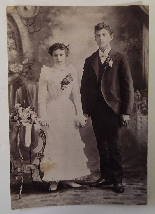 Edwardian photo of young Man and Woman in Wedding Clothes  -  Real Sepia tone Photo - Info on back, maybe siblings?