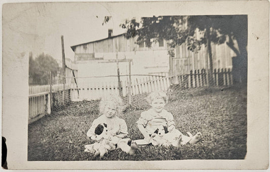 RPPC - 1911 Ohio - Two Young Sisters Playing With New Puppies In the Yard - Farm Life 1911 - Very Early Christmas Photo Card