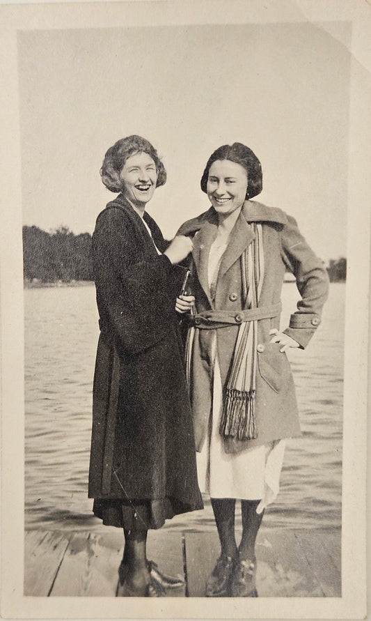 Photo Of Two Smiling Women On Dock - Fashionable Outerwear- late1920s Short Wavy Hairstyles - Spring is Arriving near Lake Michigan