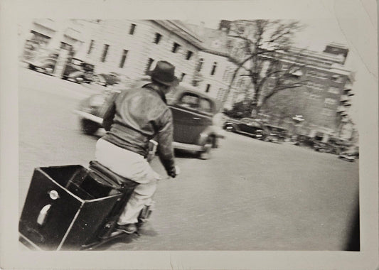 RPPC - Motion Photography - Man Traveling On Scooter/Motorcycle - On City Street With Trees and Cars - Big City Scene early 1940s