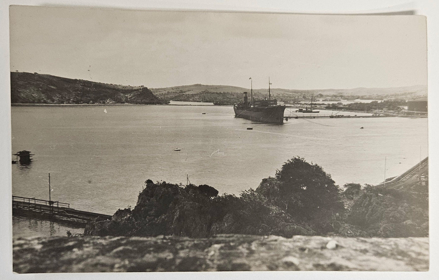 Photo Of Large Battle Ship Entering a Valley Harbor - 1930 to 1940