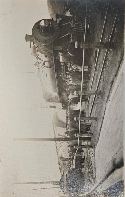 RPPC - Train Wreck with Crowd of Men Observing - 1915 Real Photo Postcard with Train Car Tipped to Side