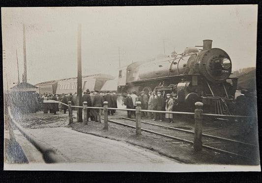 RPPC - Train Wreck with Crowd of Men Observing - 1915 Real Photo Postcard with Train Car Tipped to Side