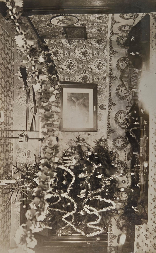RPPC - 1910 Christmas Tree Decorations - Hunter's Christmas Decor - Tinsel Garlands, Nativity Scene, and Mounted Guns - Hunter Heaven in 1910