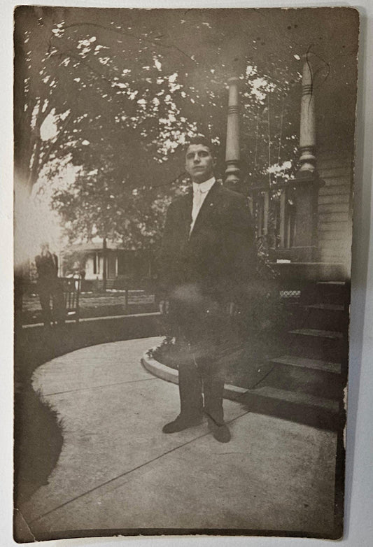 RPPC - Portrait - Young Man in Suit by Porch Steps about 1915 - stampbox was dated 1904 to 1918  - Full bleed photo -Maybe J. Edgar Hoover