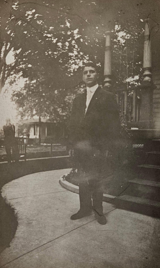 RPPC - Portrait - Young Man in Suit by Porch Steps about 1915 - stampbox was dated 1904 to 1918  - Full bleed photo -Maybe J. Edgar Hoover
