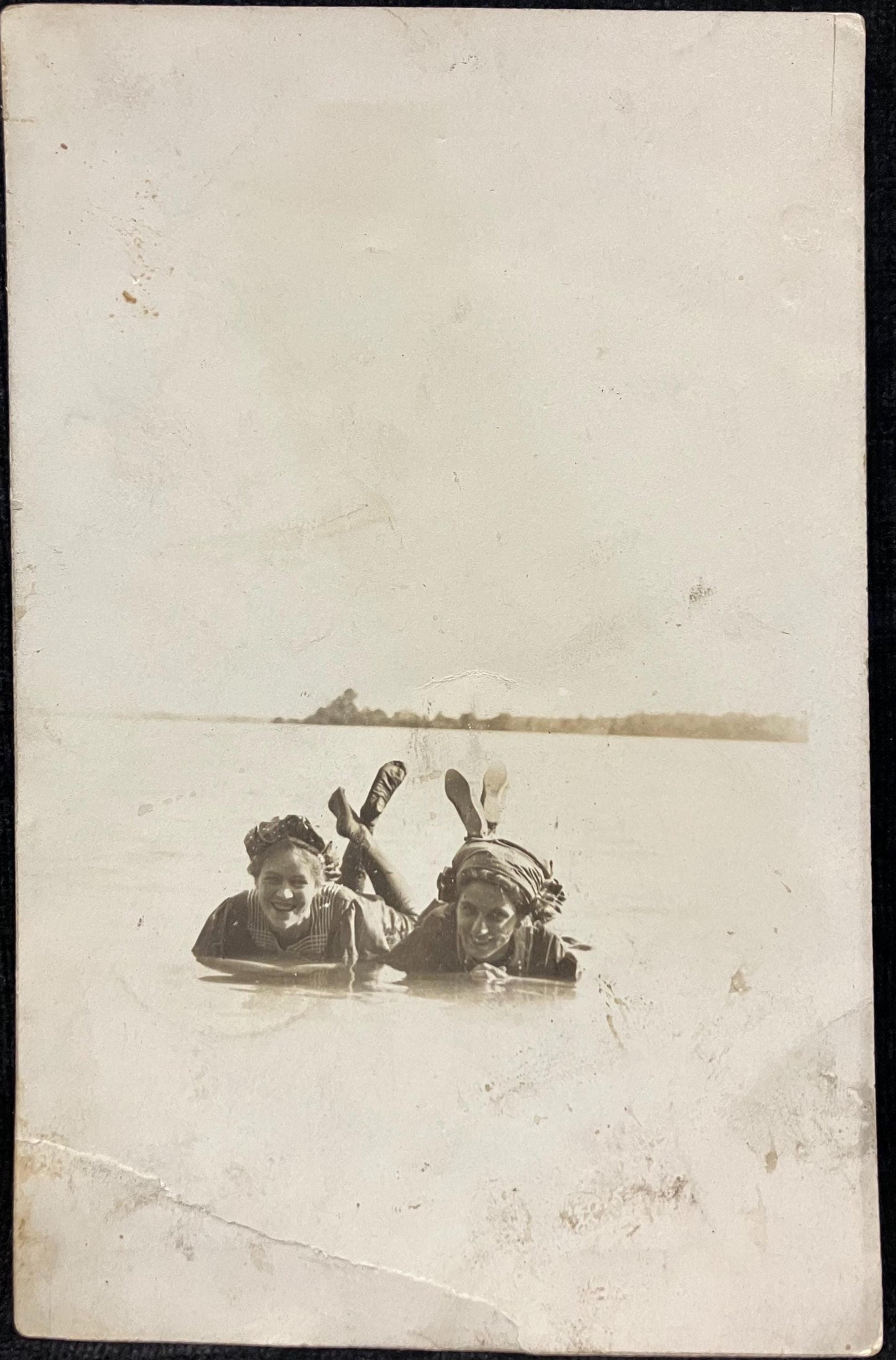 RPPC - Two Young Women Enjoying a Lake - Feet up out of the Water - 1910 Grayling, Michigan -Bathingwear with caps Lake life postcard