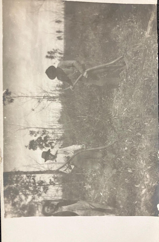 RPPC - Three Men Standing in a Field, Two in Hats are Using Scythes to Cut the Vegetation - a Third man is Visiting - 1930s Midwest Photo