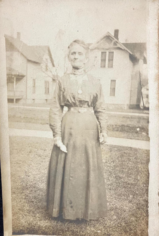 RPPC - Older Woman Standing in 1890 -1900 Midwestern Neighborhood - Late Victorian Era Clothing and Hairstyle - 1890s real Photo postcard