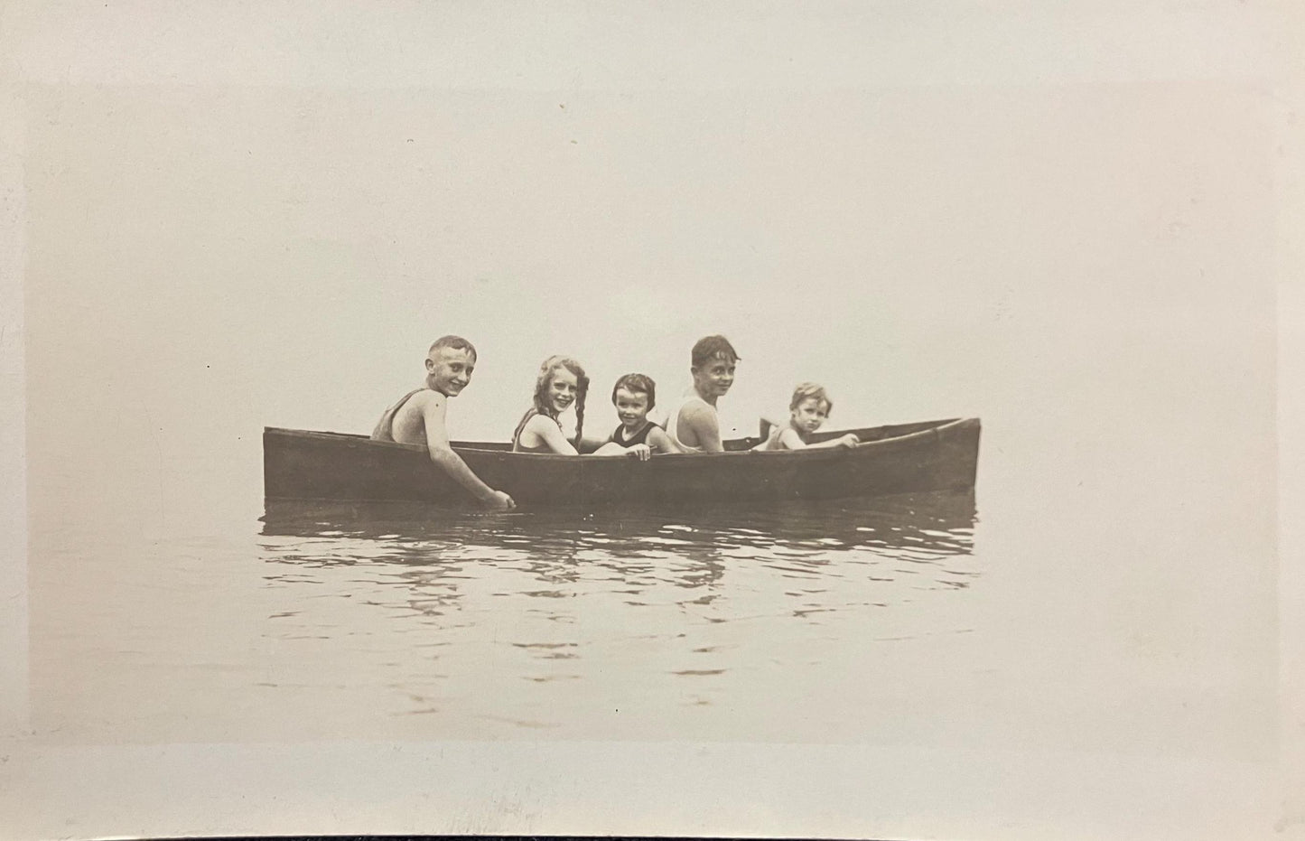 RPPC - Five Smiling Children Sitting in a Canoe at South Haven, Michigan - Wet Children pose in Canoe on Lake Michigan - Real Photo Postcard