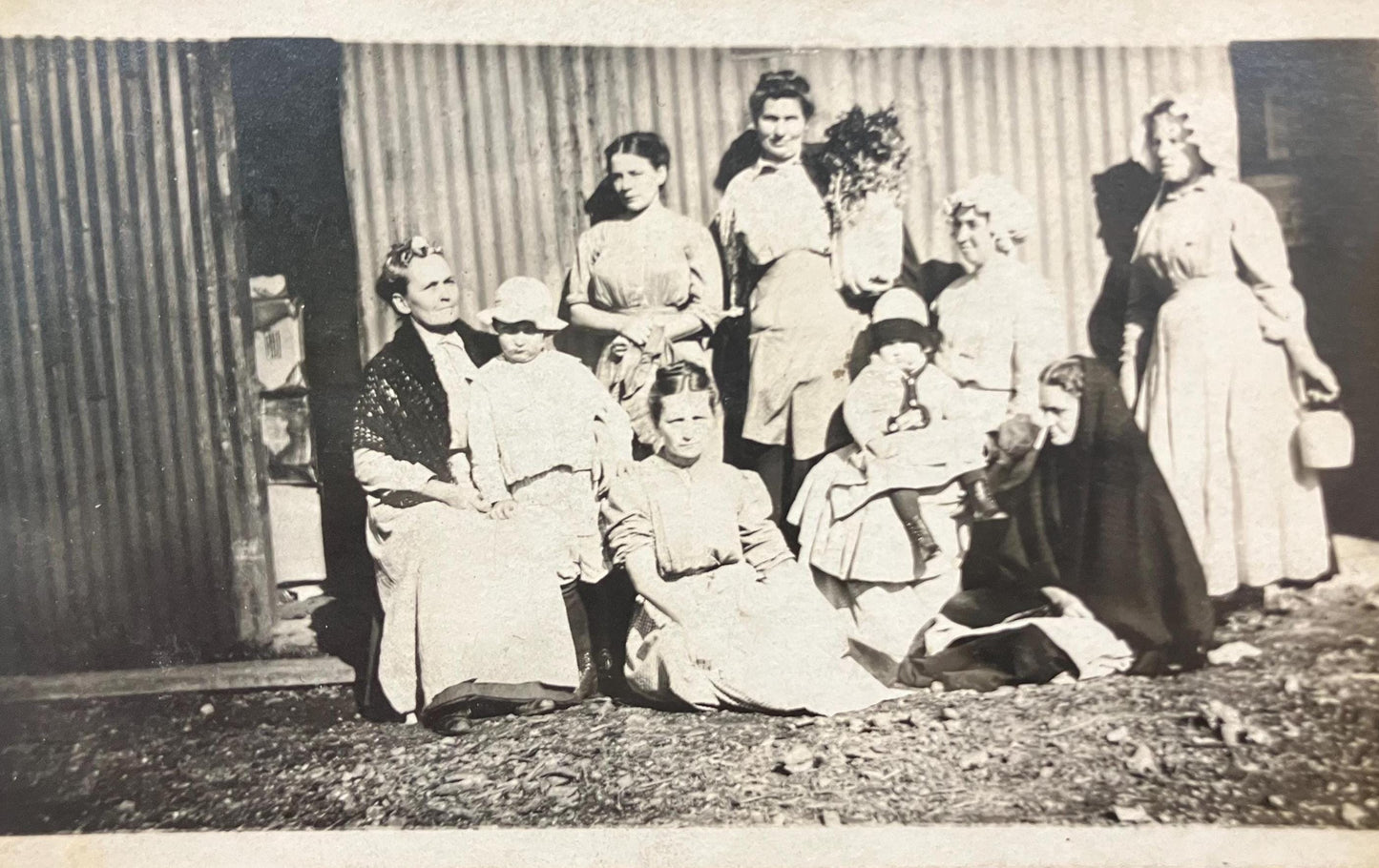 Family Photo -Women and Children Dressed in Victorian Day Wear and Bonnets - Real Photo Postcard