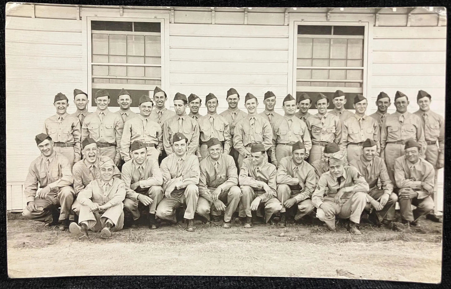 RPPC - WWII Soldiers Pose In front of their Barracks - Vintage Armed Forces Postcard