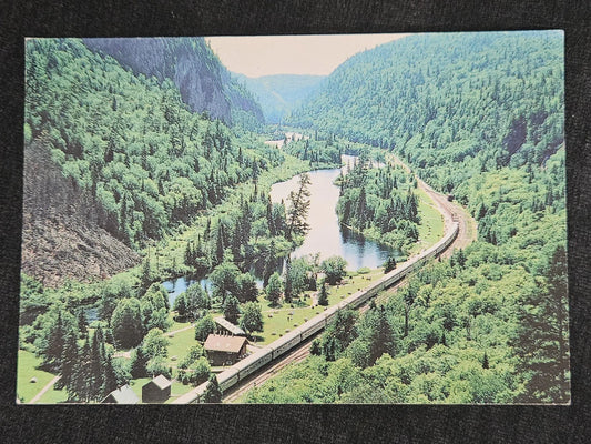 Agawa Canyon Passenger Train Passing through Valley on Railroad Tracks - Scenic Marie Ontario Canada