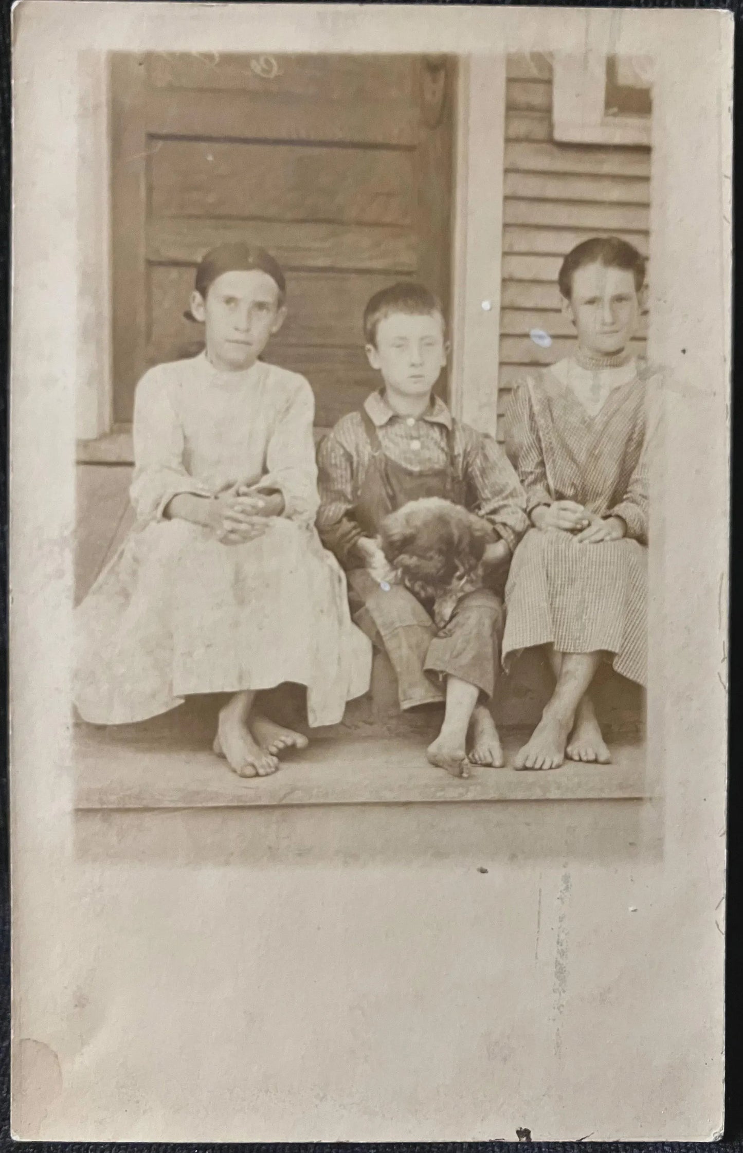 RPPC - Kids and pet sitting on steps - Vintage Postcard
