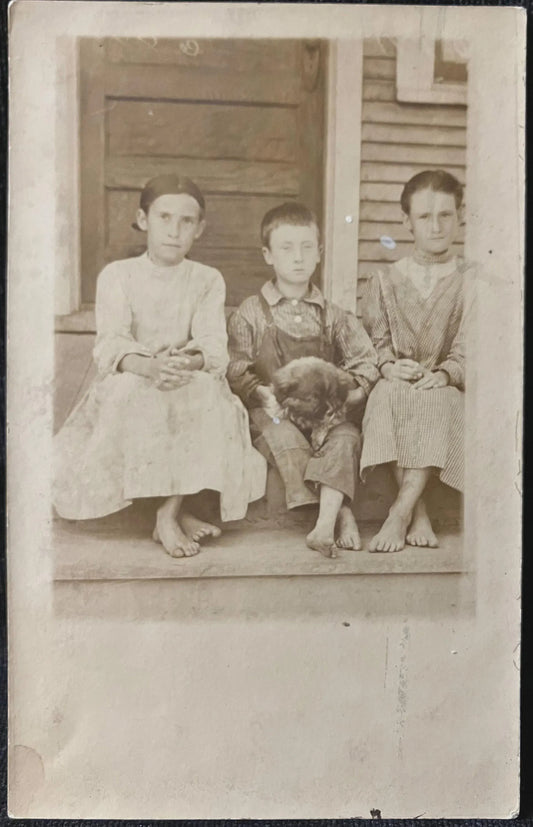 RPPC - Kids and pet sitting on steps - Vintage Postcard