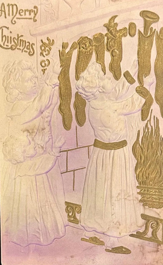 A Merry Christmas, Embossed Card with Gold Gilded Socks Hung by the Fireplace - Vintage Postcard
