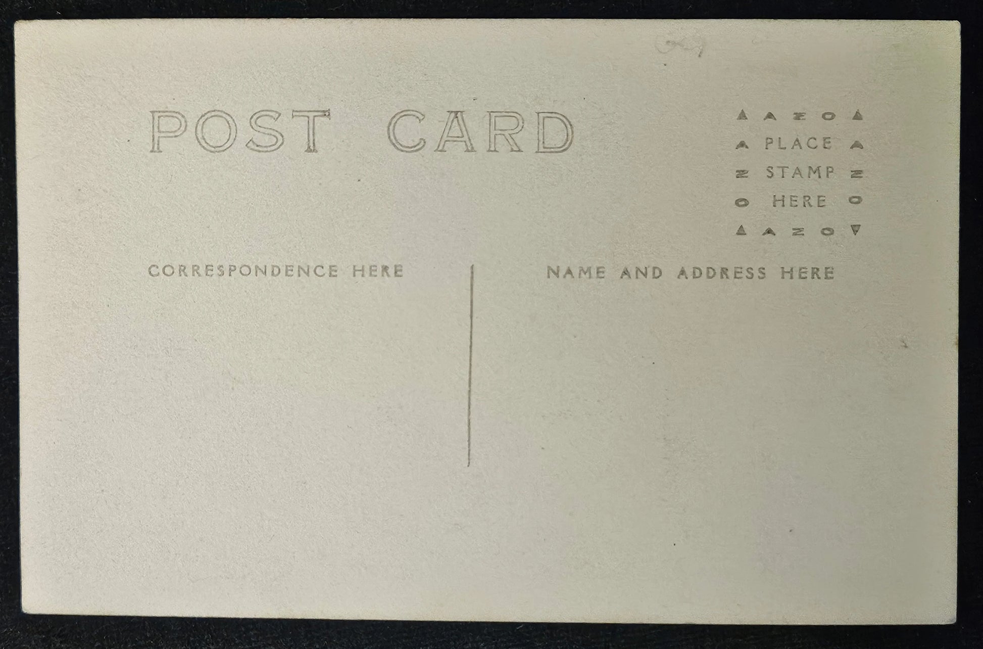 Back of a vintage postcard of horsesgrazing with text fields for correspondence and address.