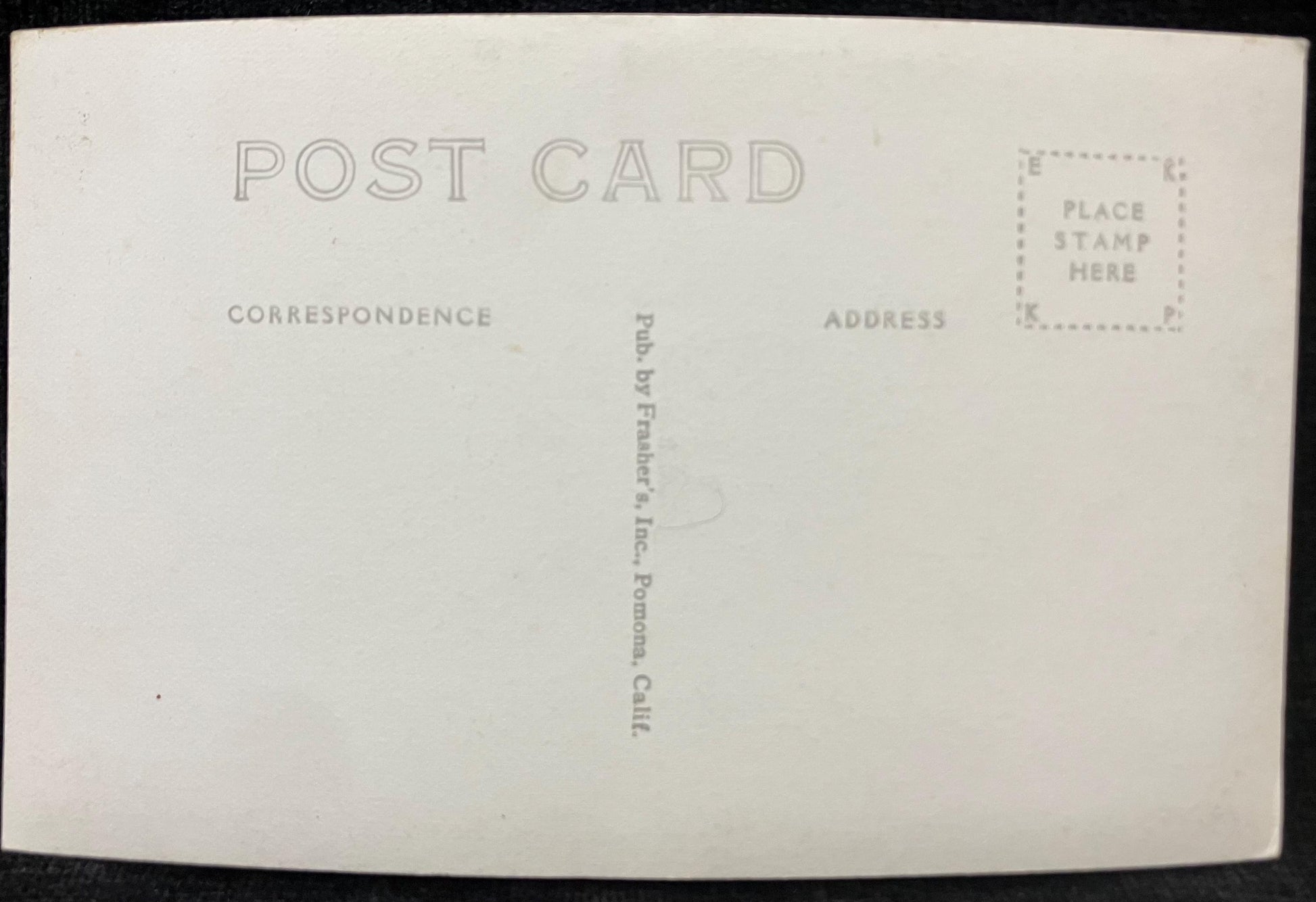 Back of a postcard with text and stamp area