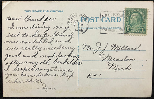 Vintage postcard with handwritten message and postage stamp
