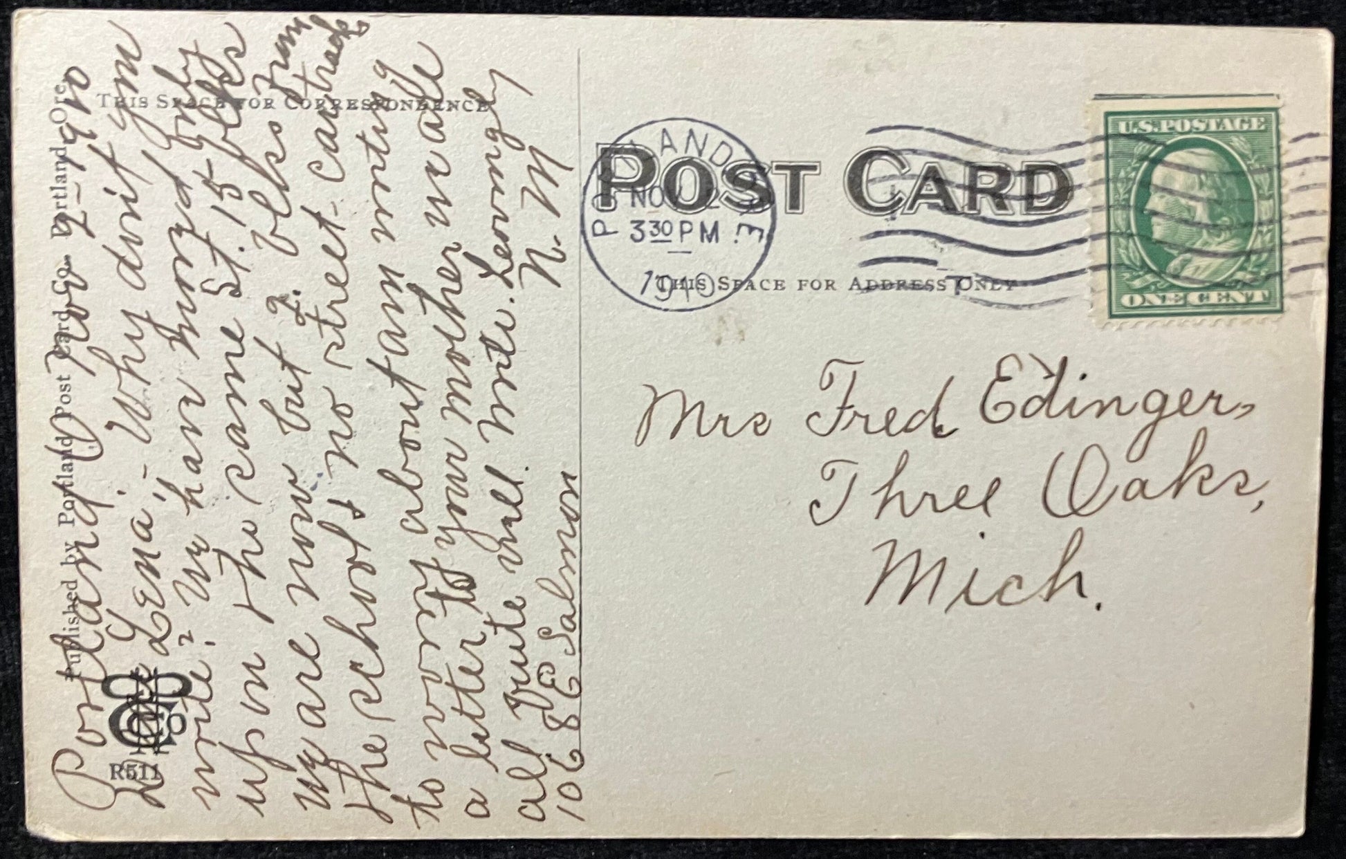 back of vintage postcard with one cent Ben Franklin stamp and 1910 postcard. Handwritten address and note