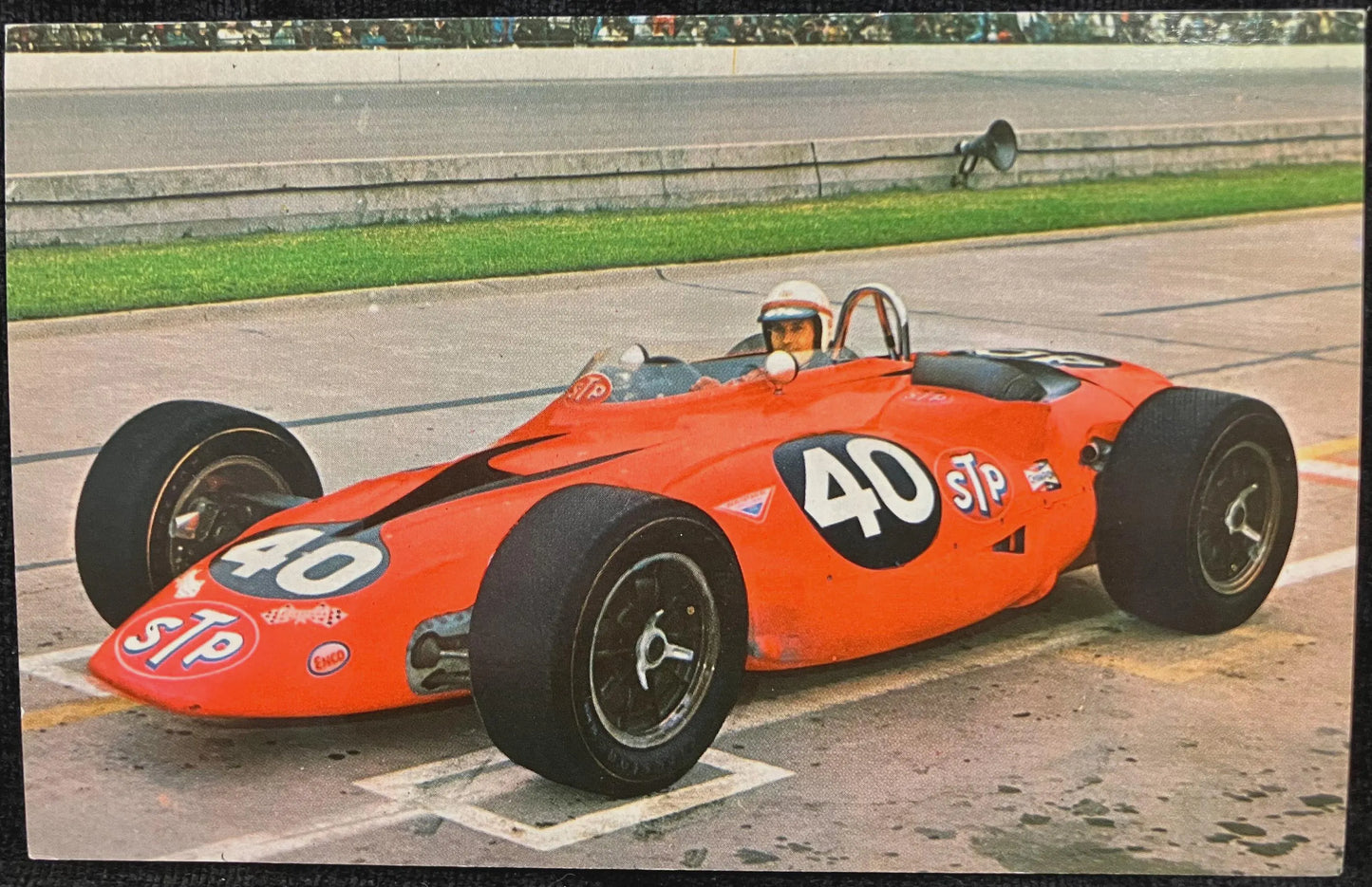 Vintage red racing car with number 40 on a track
