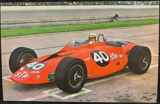 Vintage red racing car with number 40 on a track
